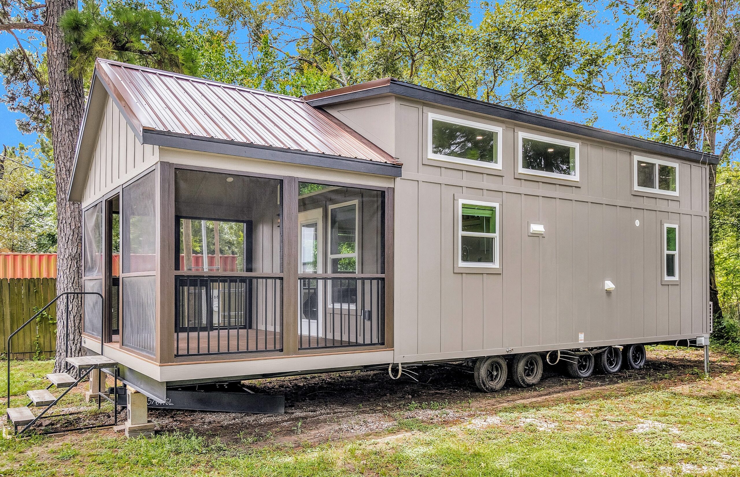 Exterior of the Tumbleweed tiny home featuring a compact design and modern finishes